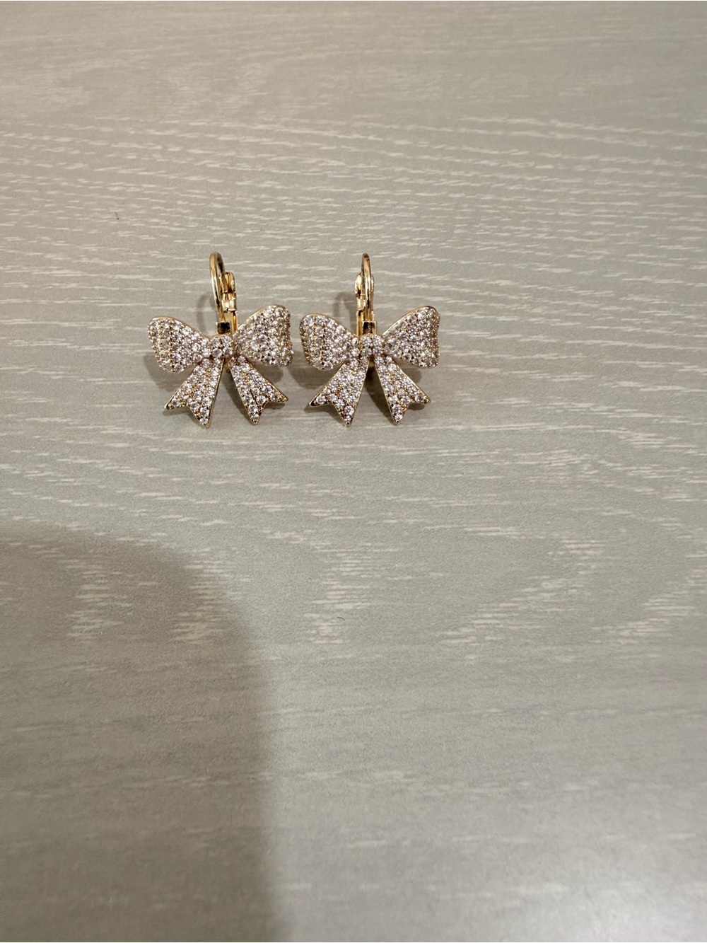 Sparkling Gold Bow Drop Earrings with Crystal Pavé
